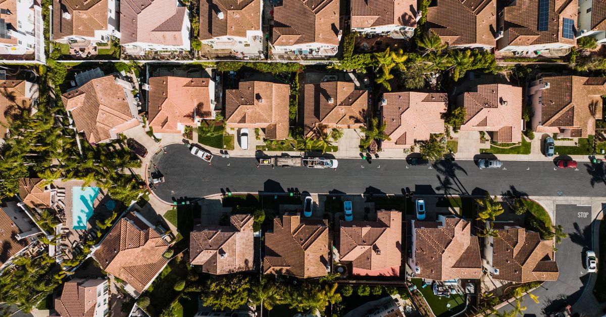 Aerial photograph showcasing a suburban neighborhood in Costa Mesa, CA, with neatly arranged houses and streets.