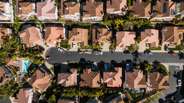 Aerial photograph showcasing a suburban neighborhood in Costa Mesa, CA, with neatly arranged houses and streets.