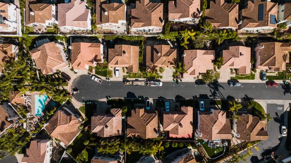 Aerial view of a suburban street with detached houses