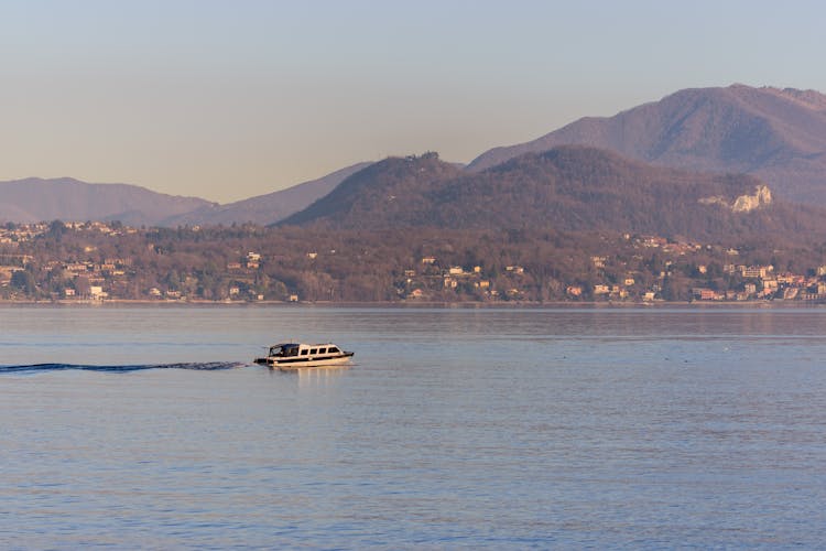 Motorboat On A Lake At Sunset 