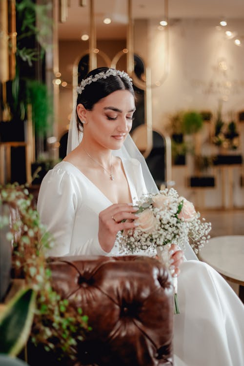 Beautiful Woman Looking at Her Bouquet