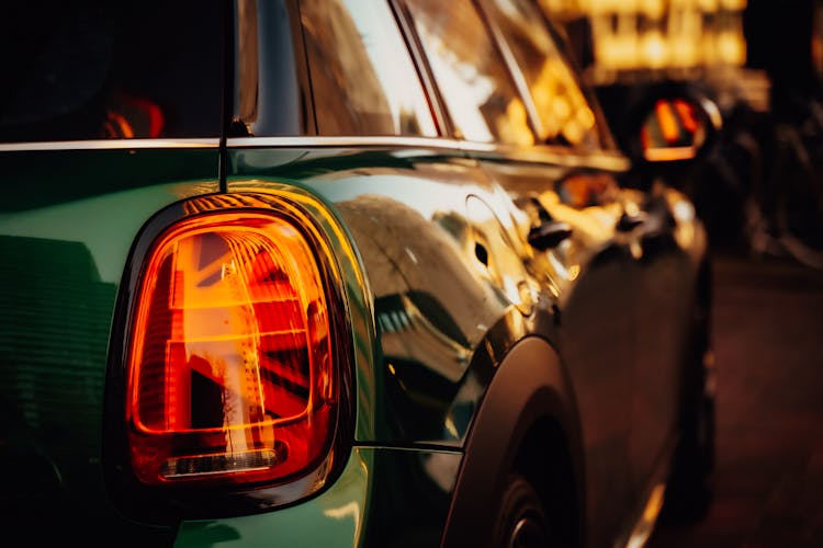 Green Shiny Car Ib Close Up Photography