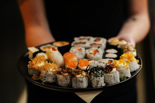 Selective Focus of Sushis on Black Plate