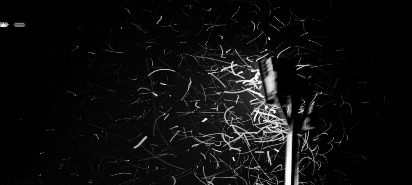 Insects swarming around a streetlight at night — the classic termite swarm after rain in Malaysia
