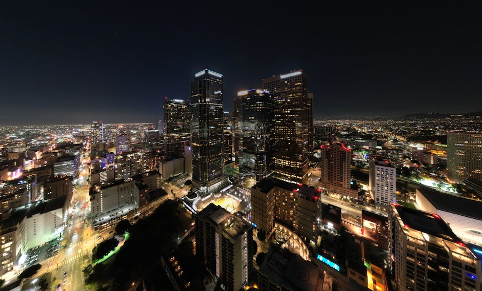 Experience the vibrant cityscape of Los Angeles with its illuminated skyline captured at night.