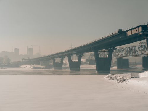Free A misty winter view of a steel bridge over the frozen river in Novosibirsk, Russia. Stock Photo