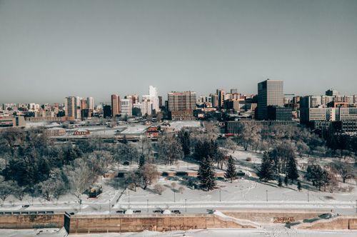 Free Aerial view of the snow-covered cityscape of Novosibirsk, featuring dramatic winter scenery. Stock Photo