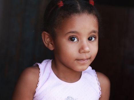 Close-up portrait of a young girl with beautiful eyes conveying innocence.