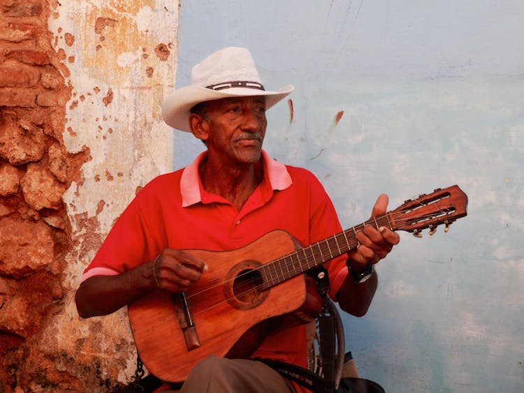 Elderly Man Playing The Guitar 