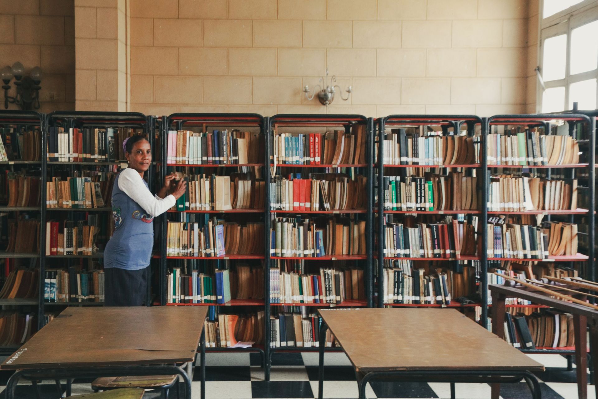 Woman Standing in Library