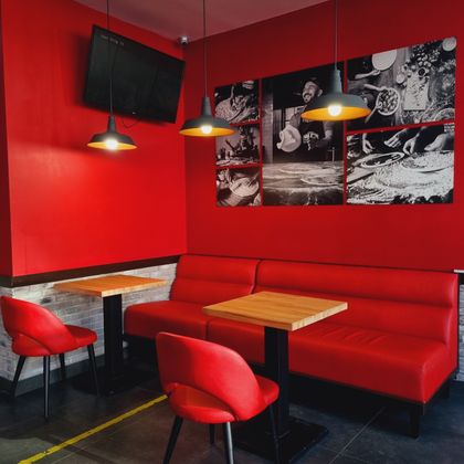 Red-walled dining room — photo by Maisy Vi on Pexels