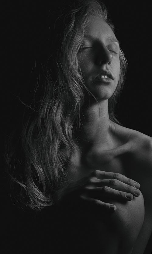 Free Artistic black and white portrait showcasing serene expression of a woman. Stock Photo