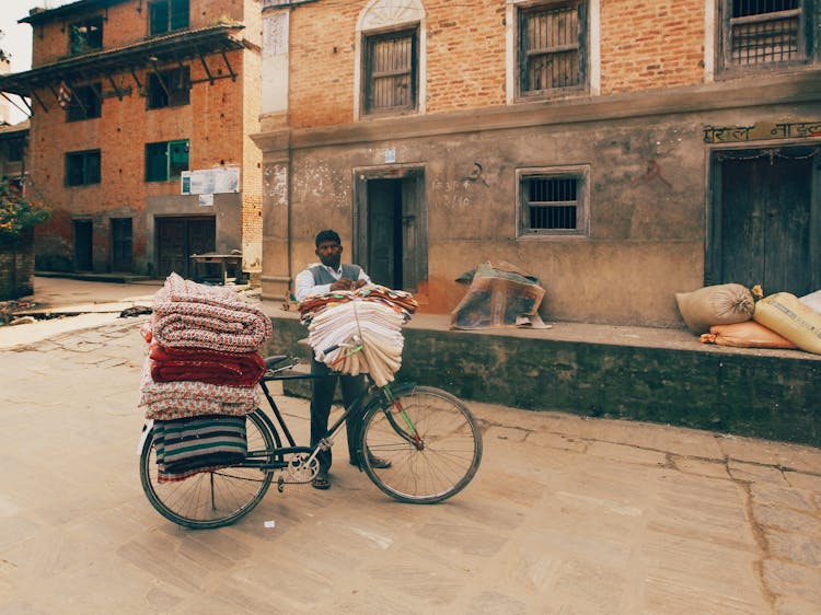 Merchant Transporting Fabric On Bicycle