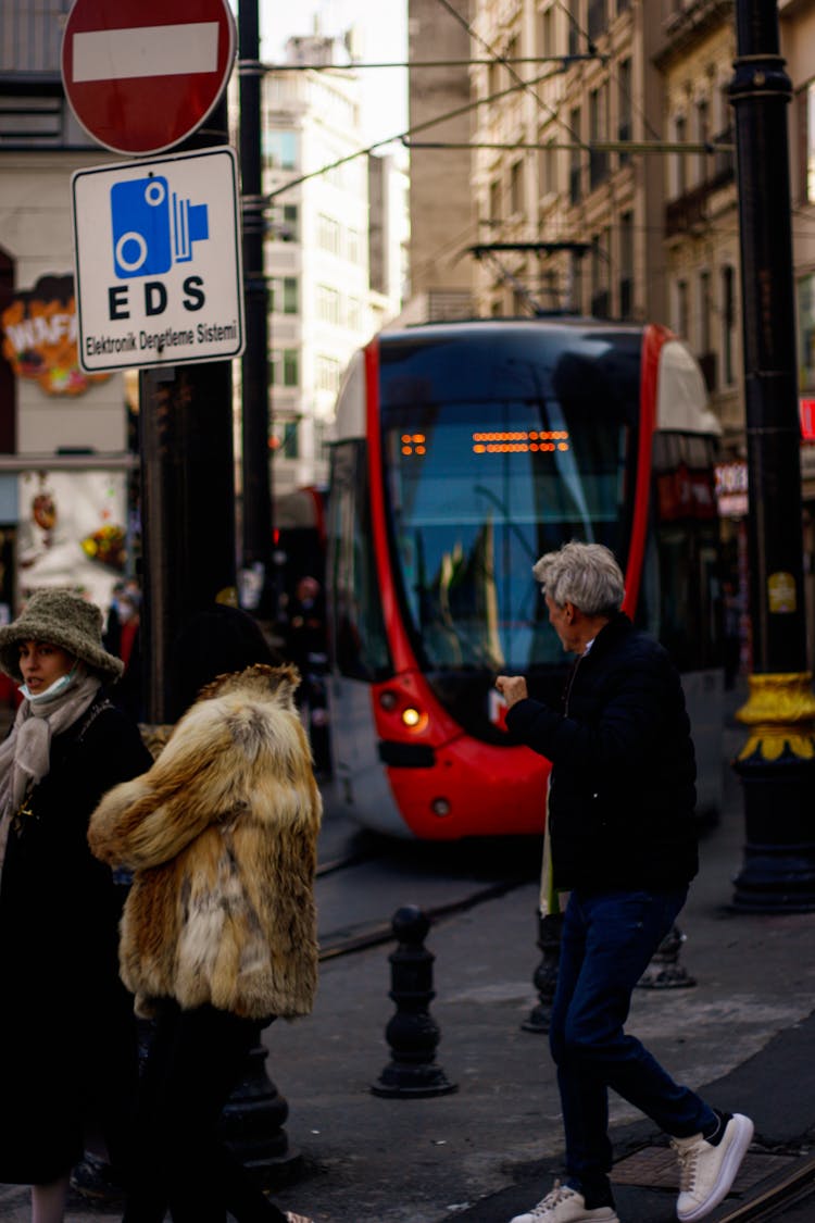 Busy City Street With Tram And People Around