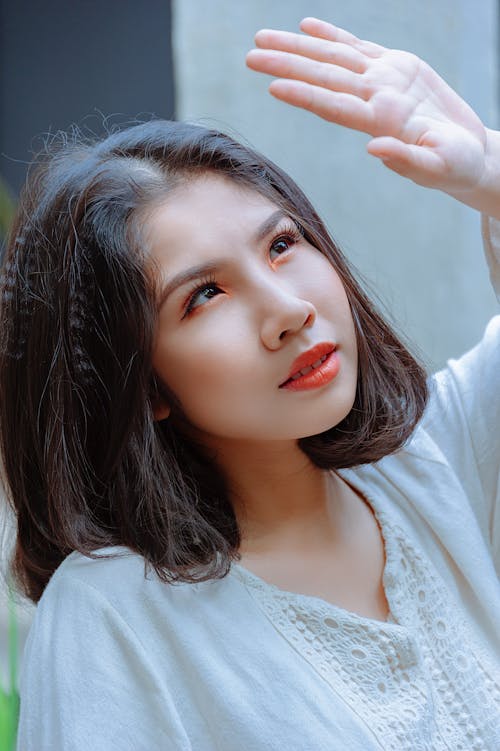 Shallow Focus Photography of Woman in White Top