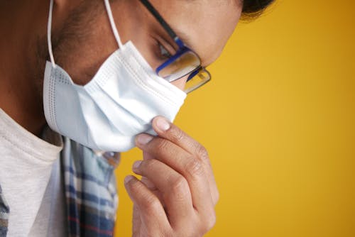 Close Up Photo of a Man Wearing Face Mask