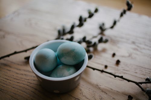 Blue and White Eggs in White Ceramic Bowl