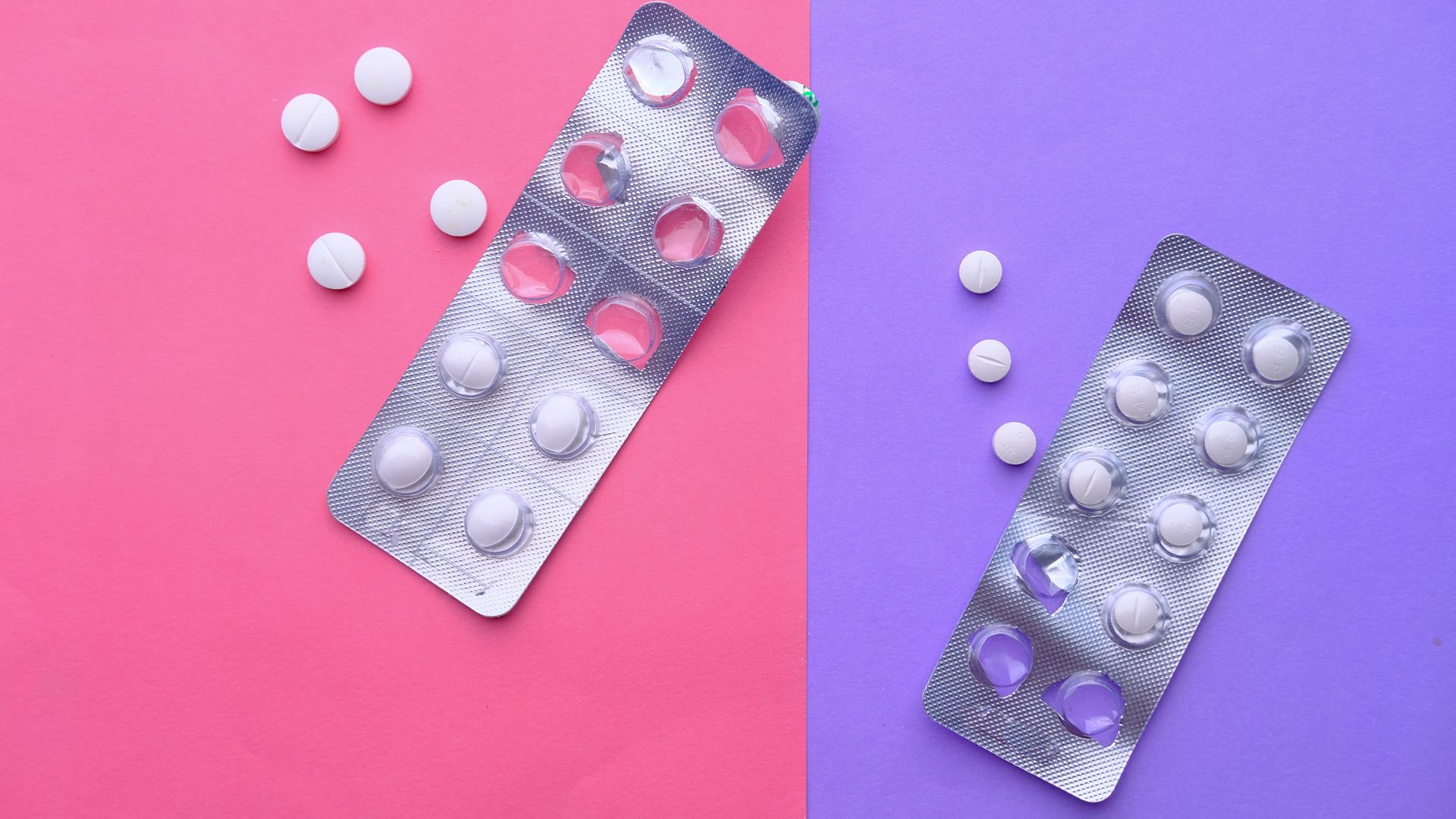 Buy Modalert 200: A Comprehensive Guide Top view of blister packs and pills on a vibrant pink and purple background.