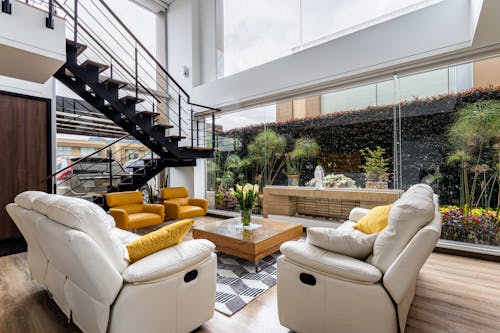 A Modern Living Room Near the Glass Walls