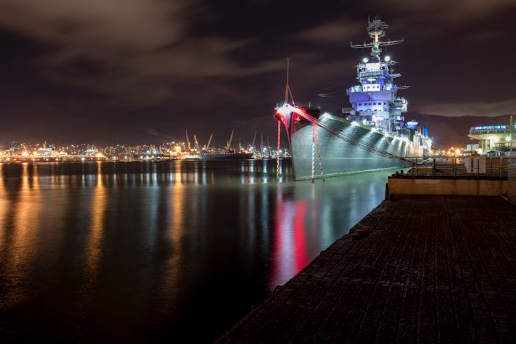 Illuminated Navy Ship At Night In Harbour In Novorossiysk, Russia