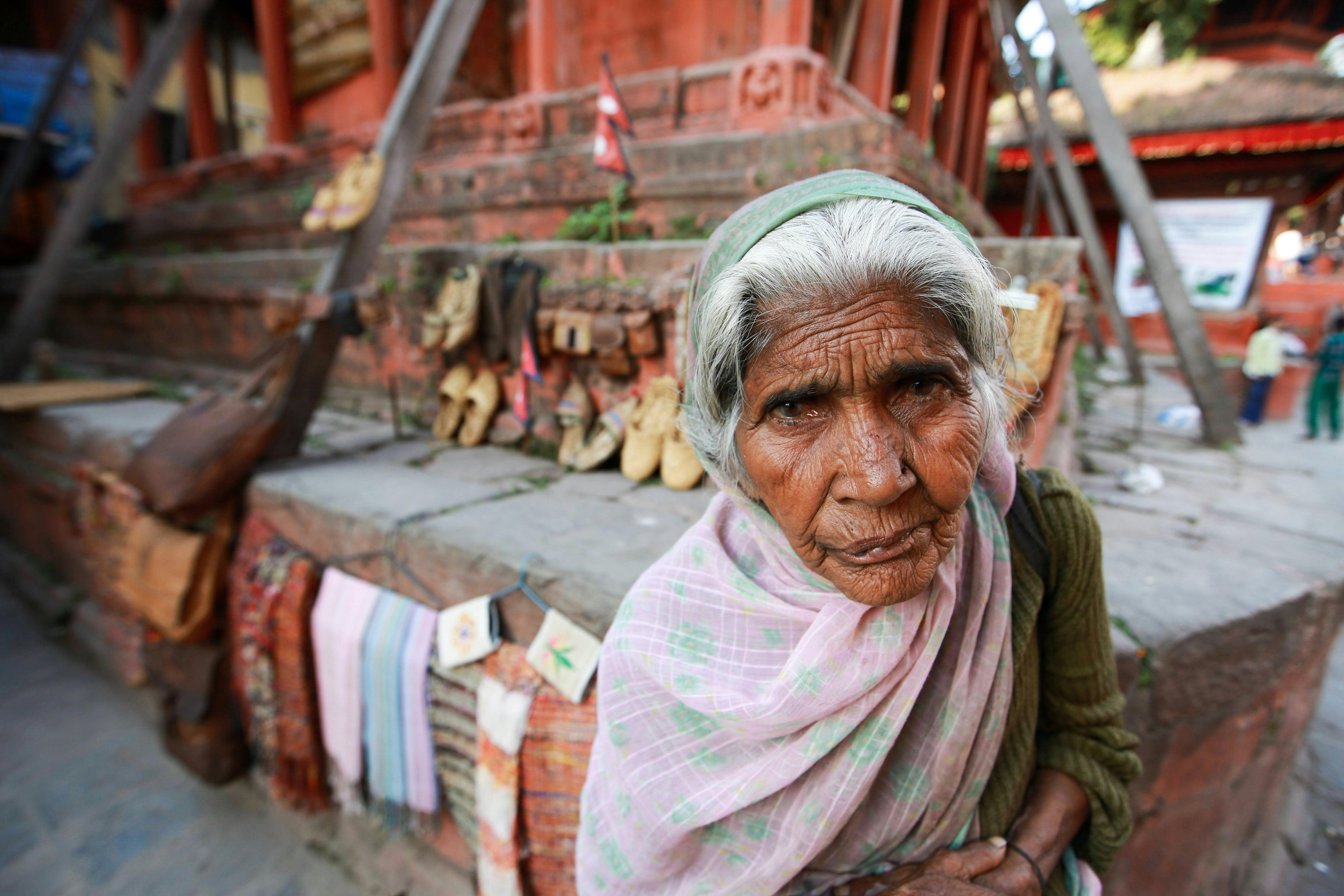 Serene Woman Selling Corn Grains · Free Stock Photo