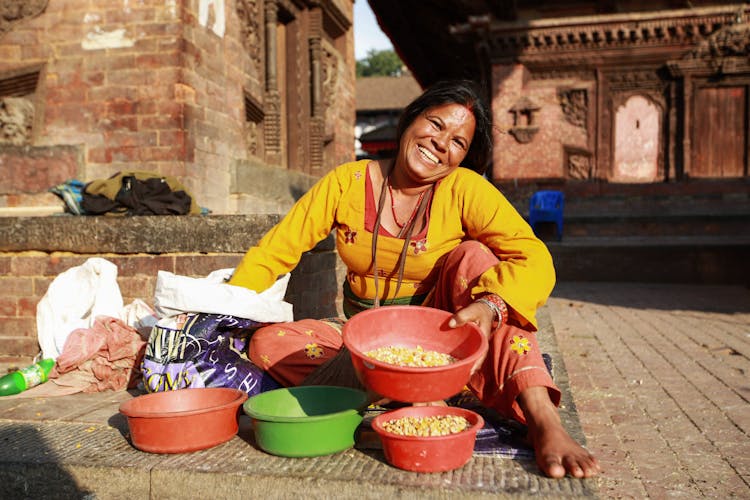 African-American Woman Selling Food On The Market