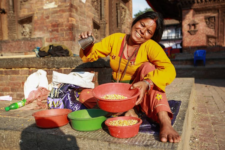 Smiling Woman With Bowls Of Food