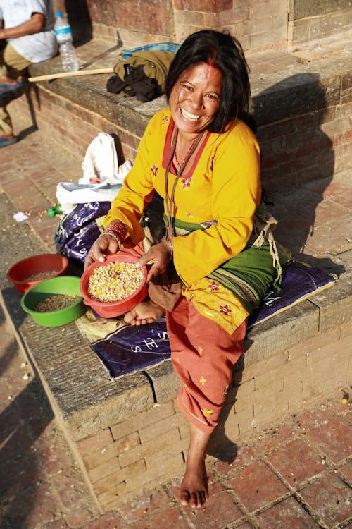 Serene Woman Selling Corn Grains