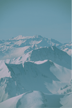 Explore the breathtaking snowy peaks of Furna, Switzerland, captured in a serene winter scene.