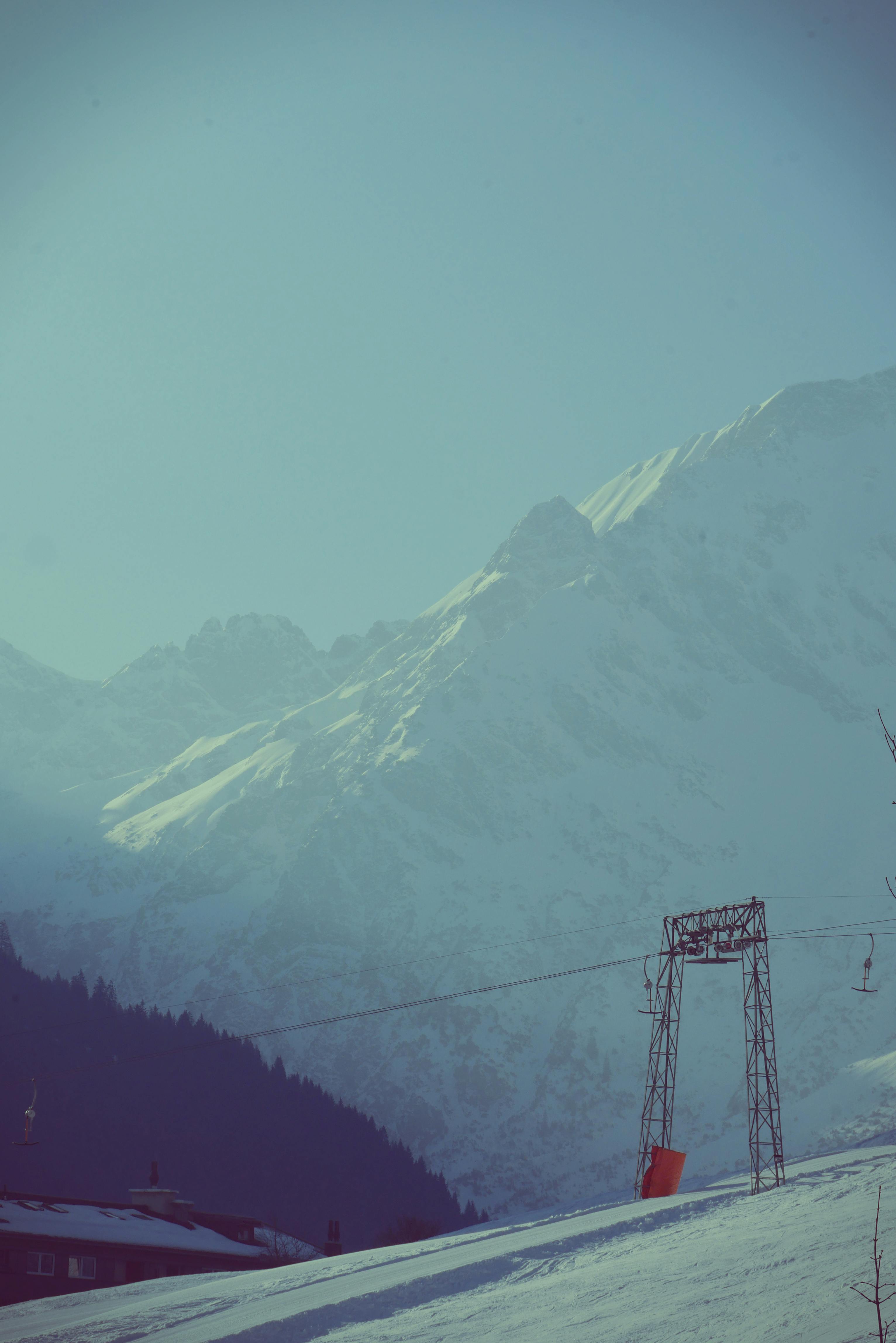 Prescription Goggle Inserts - Captivating winter scene of snow-capped mountains and a ski lift in Vorarlberg, Austria.