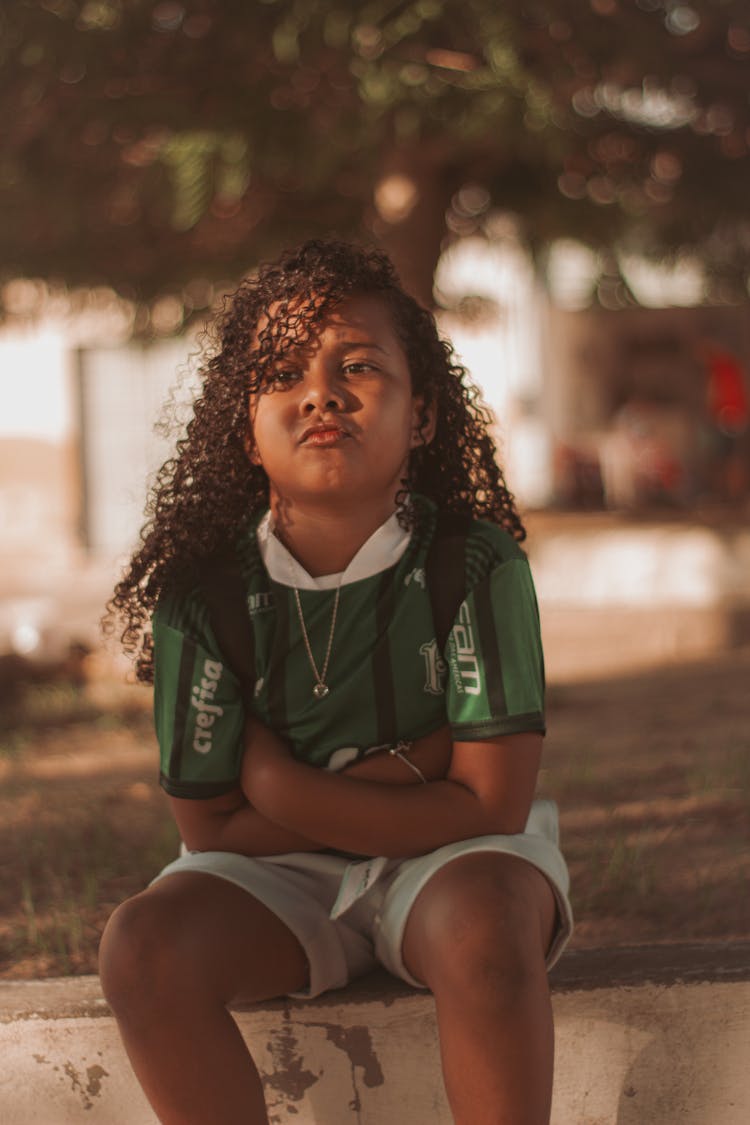 Girl Sitting And Pouting