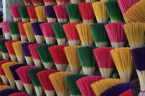 Close up of Colorful Brooms