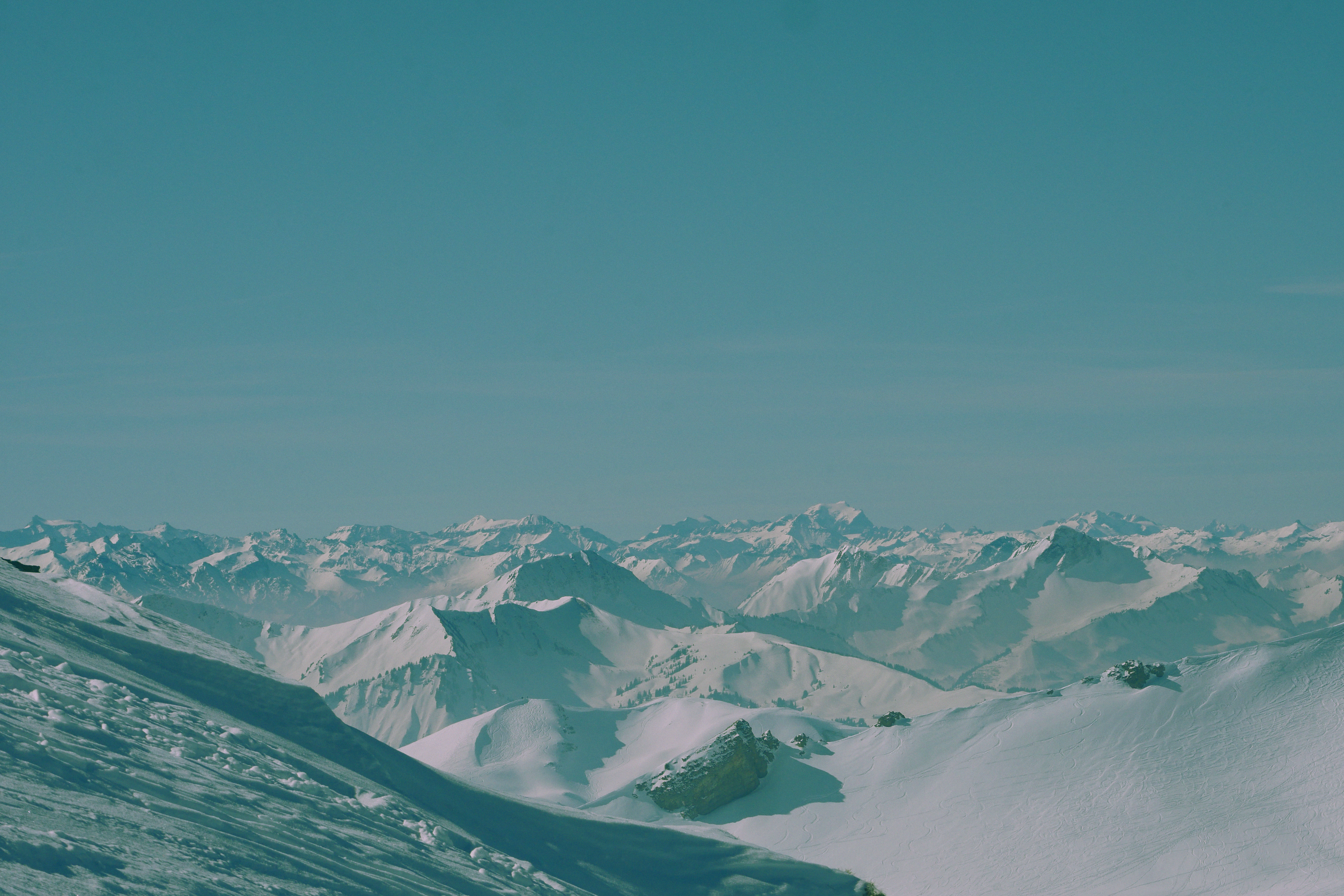 Snow Covered Mountains Under Clear Blue Sky · Free Stock Photo