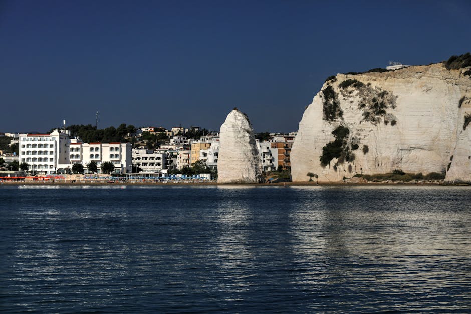 Stunning view of Vieste's cliffs and coastal town, ideal for travel and tourism imagery.