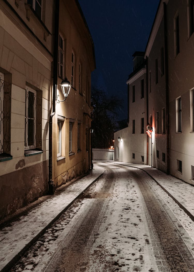 Cobblestone Street With Snow During Night Time