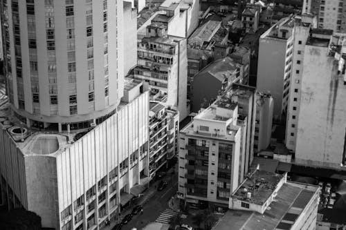 Grayscale Photo of High-rise Buildings