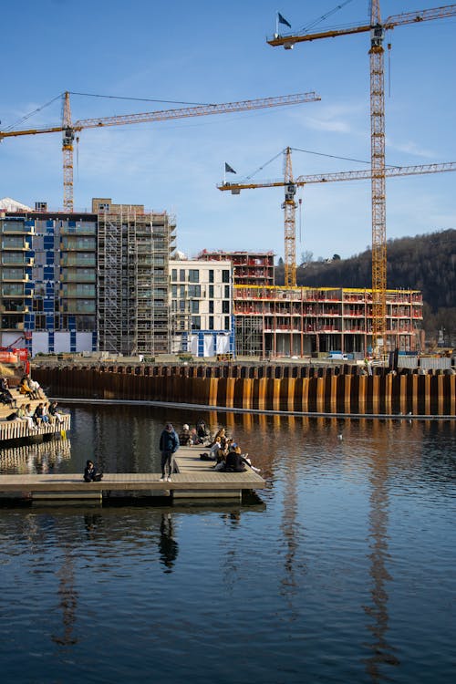 People Sitting On A Wooden Deck