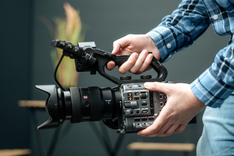 A Person Holding a Video Camera 