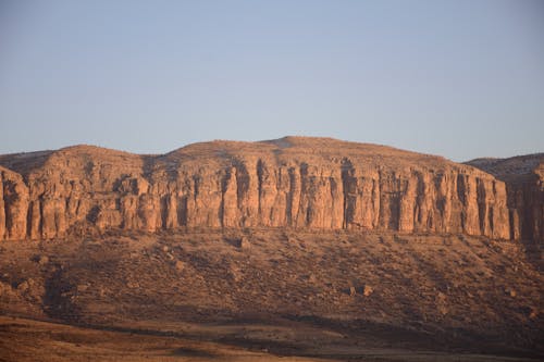 Brown Rock Formation under Blue Sky