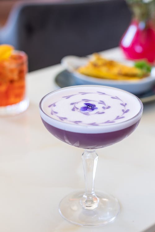 Purple and White Drink on White Surface