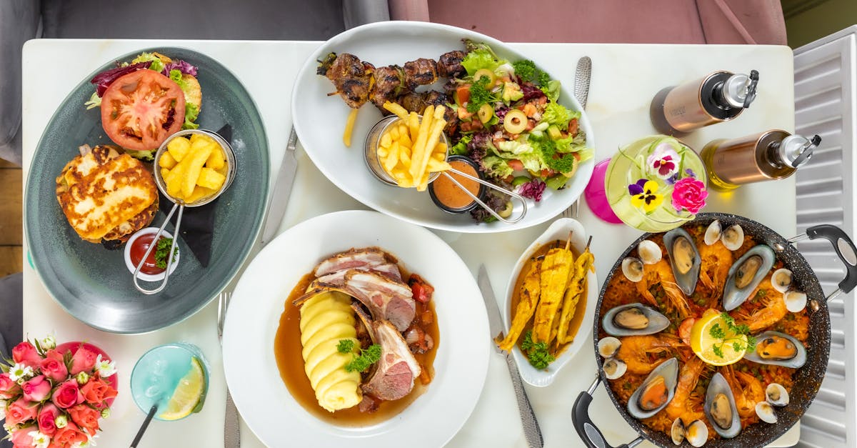 A refreshing red sangria cocktail in a traditional Spanish pitcher surrounded by slices of fresh fruit on a wooden table.