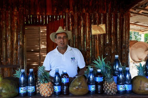 Man Behind the Counter of a Beach Bar