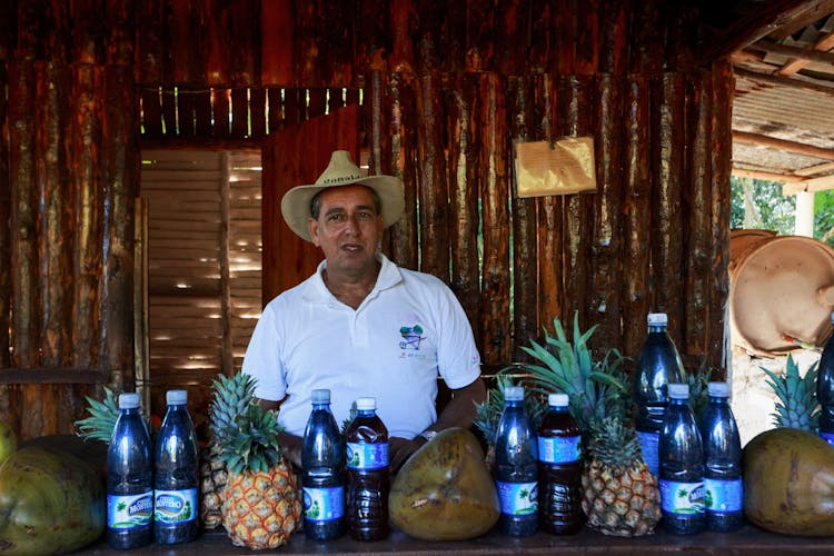 Man Behind The Counter Of A Beach Bar