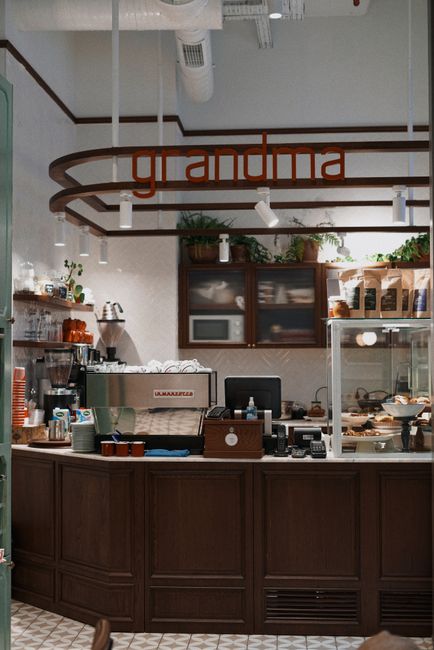 Inviting café counter with vintage decor and coffee equipment, creating a cozy atmosphere.