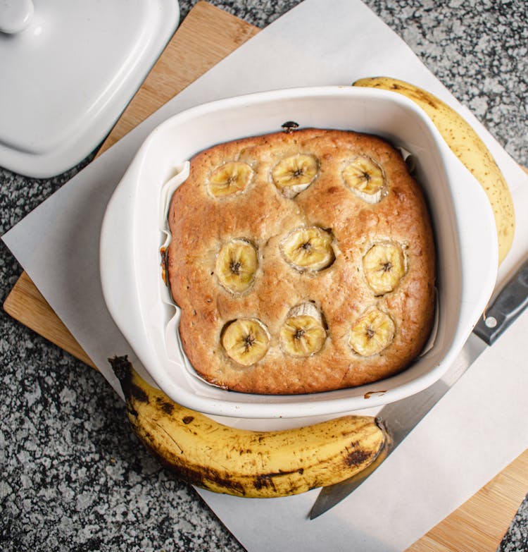 Overhead Shot Of A Banana Bread In A White Container