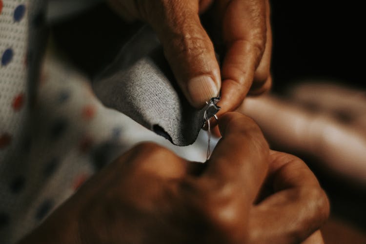 Close Up Of Woman Hands Sewing