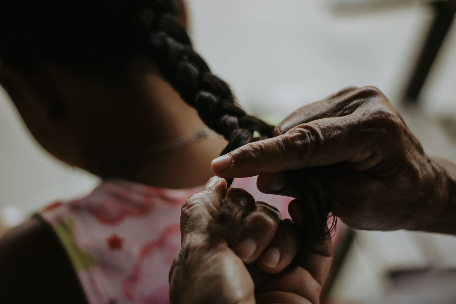 Hands braiding hair