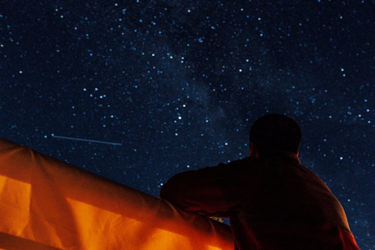 Man Looking At Night Sky