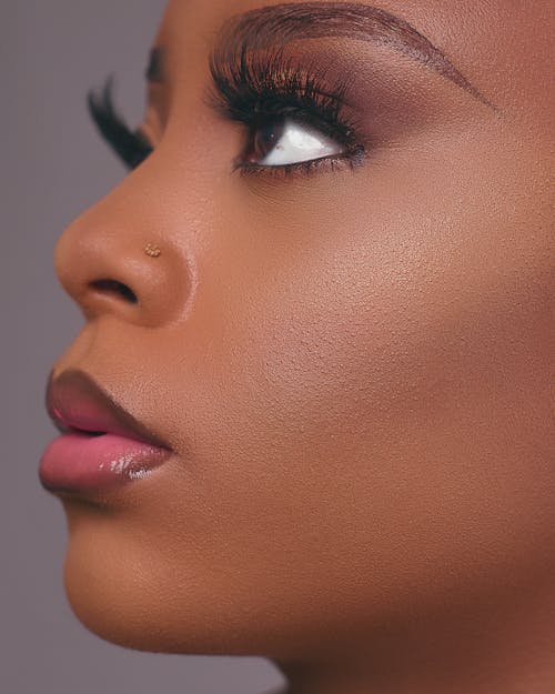 Close Up Photo of Woman Wearing Makeup