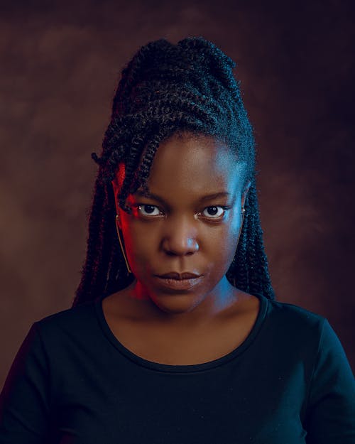 Close Up Photo of a Woman with Braided Hair